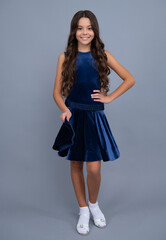 Happy girl face, positive and smiling emotions. Elegant charming teenager fashion child girl. Full length of teenager child girl wearing ball dress.