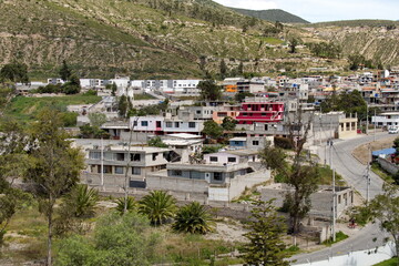Overhead view of a Quito suburb from the equator monument at the Mitad del Mundo park in the suburbs of Quito, Ecuador