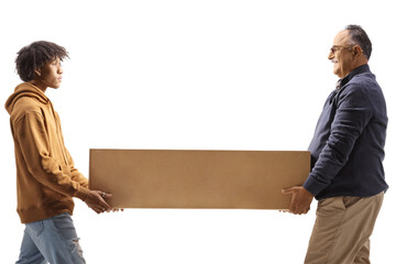 Mature man and a young african american man carrying a cardboard box togeather