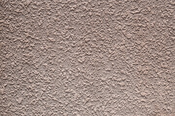 ベージュのでこぼこした壁