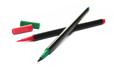 Red and green brush pens isolated on white, side view