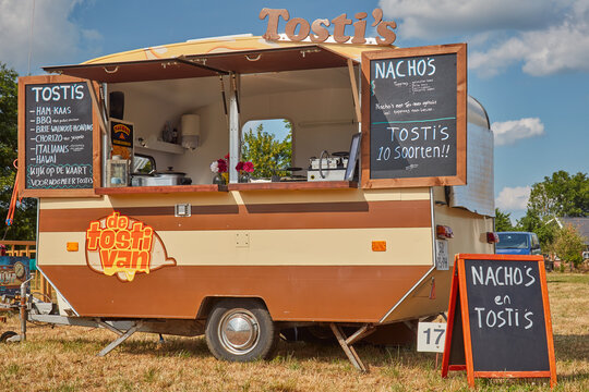 Decorative retro caravan food truck on a country fair in Aalten, The Netherlands on June 23, 2023
