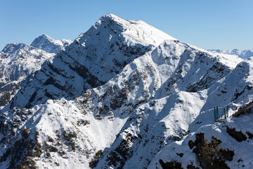 Fototapeta na wymiar Kamenniy Stolb - Peak covered with snow, Sochi, Krasnaya Polyana, Rosa Khutor, Russia