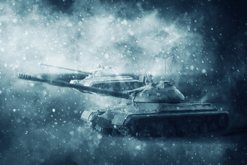 Two battle tanks moving in a snow storm on a mission