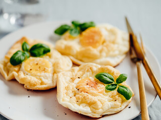 Fluffy Cloud Eggs. Trendy food - oven bake scrambled eggs with whipped egg white and whole yolk on...