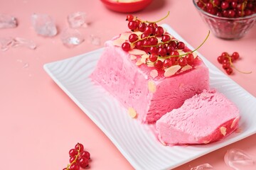 Summer refreshing dessert, Italian semifreddo ice cream with red currants on a white rectangular...