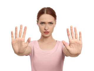 Woman showing stop gesture on white background