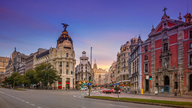 Panoramic cityscape image of Madrid, Spain during sunrise.