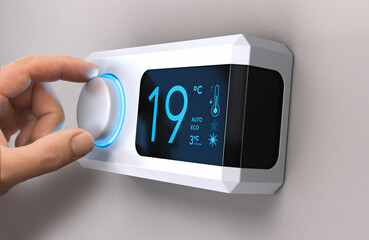 Hand turning a home thermostat knob to set temperature on energy saving mode. Celsius units. Composite image between a photography and a 3D background. - obrazy, fototapety, plakaty