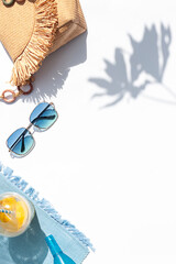 Bright summer beach vacation or travel lifestyle concept frame with lemonade, sunglasses and...