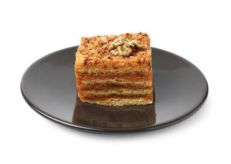 Piece of delicious layered honey cake on white background