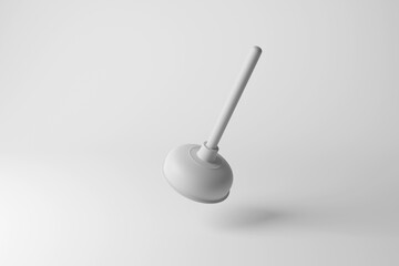 White toilet plunger floating in mid air on white background in monochrome and minimalism. Illustration of the concept of plumbers and blockages in drains and pipes