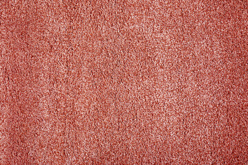 Fototapeta premium Soft coral color carpet as background, top view