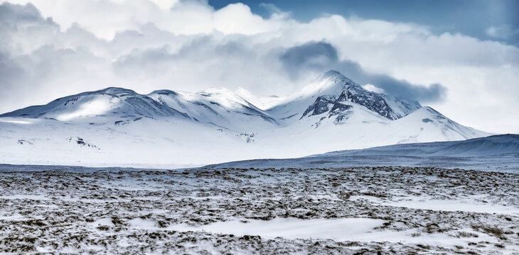 Winter mountains landscape, beautiful view on the mountains covered with snow, cold frosty weather, beauty of Iceland nature