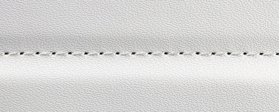 close up beige or white leather texture with stitched or seam background