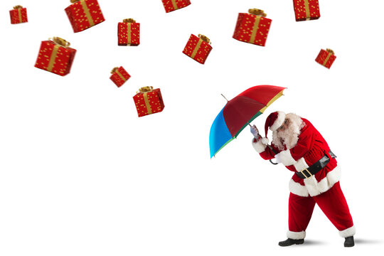 Santa claus is protected by gifts with umbrella