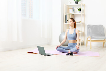 woman relaxation training mat lifestyle laptop health home yoga video lotus