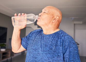 Home, fitness or senior man drinking water for wellness, hydration or exercise recovery in...