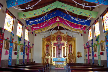 Fototapeta na wymiar Decorated interior of a chapel at the Mitad del Mundo park in the suburbs of Quito, Ecuador