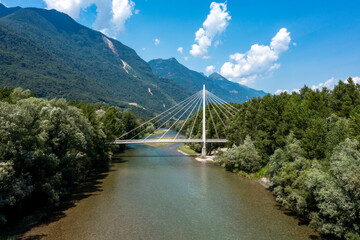 White catwalk suspended in the middle of Swiss nature. No one on it walking or cycling. View from...