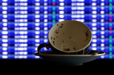 Stock forecast, illustrated by reading tea leaves (Tasseography) in front of trading screen
