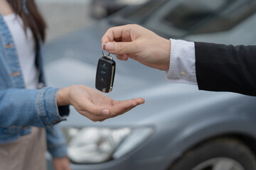 lease, rental car, sell, buy. Dealership manager send car keys to the new owner.  Sales, loan credit financial, rent vehicle, insurance,  renting, Seller, dealer, installment, car care business