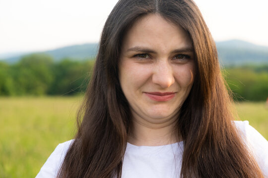 A squeamish woman looks at the camera in disgust.