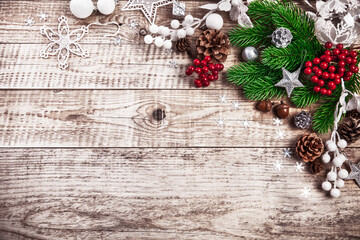 Christmas festive background with pinecone balls. Holiday greeting card branch old wooden board rustic style, copyspace and top view