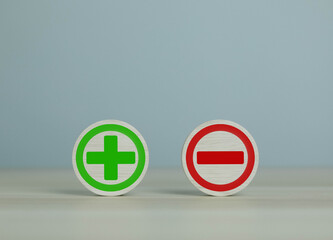 wooden blocks with plus and minus signs Comparatively opposite concepts Analyze differences to...