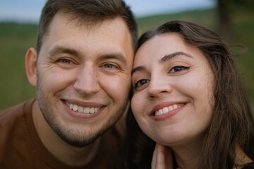 Fototapeta premium Romantic date.Valentine's day. Man and woman.Love of two people.Real couple of lovers.True emotions.People hugging.Face to face.Romance between people.The couple hugs.Happy family.Love.beautiful pair.