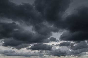Epic dramatic storm sky with dark grey clouds