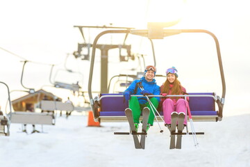 Young couple on a lift outdoors