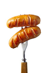 Two grilled sausages on fork over white background
