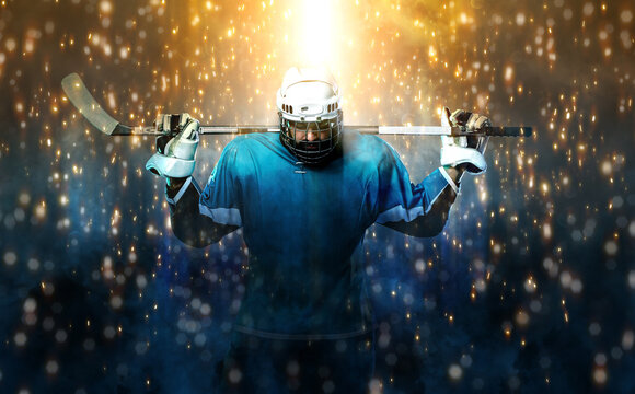 Ice hockey player in fire. Download high resolution photo. Icehockey athlete in the helmet and gloves on stadium with stick. Sport concept. Sports wallpaper.