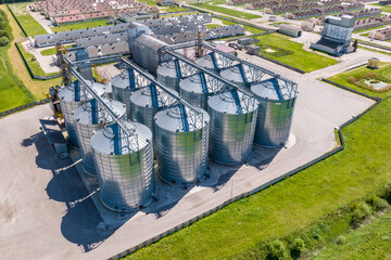 aerial panoramic view on agro-industrial complex with silos and grain drying line for drying cleaning and storage of cereal crops © hiv360