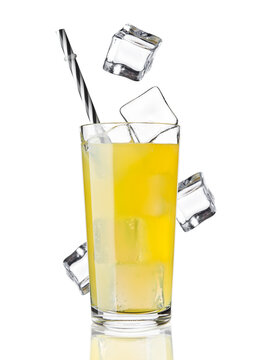 Glass of orange soda drink cold with ice cubes and straw on white background