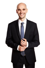 Studio shot of smiling young man in suit isolated on white background.