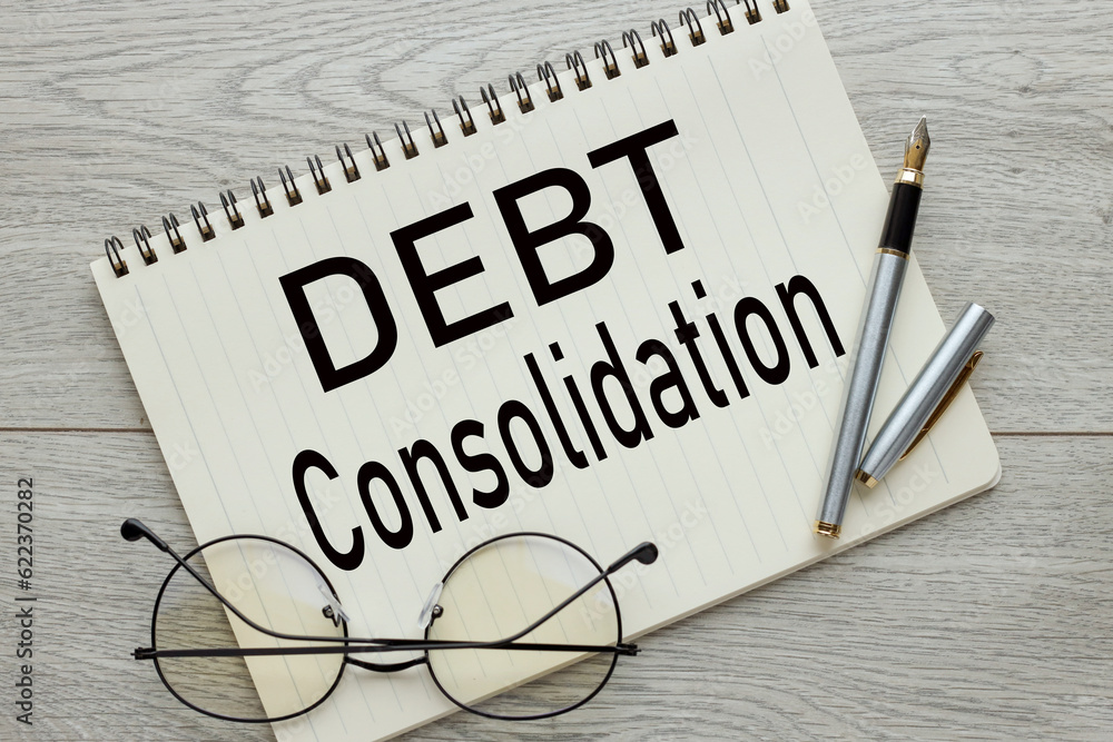 Poster open notebook with text. glasses on the work table. words. debt consolidation