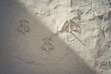 Fragment of the wall of an old Spanish house with decorative elements