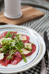 Carpaccio with beetroot and Parma cheese.