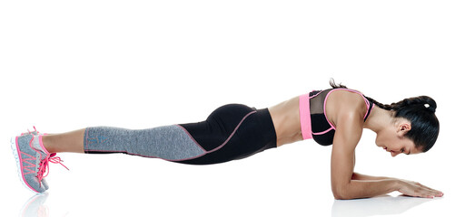 Fototapeta premium one mixed raced woman exercising fitness exercises isolated on white background