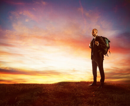 Businessman with explorer backpack looking for new business