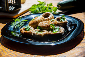 Mushrooms in black plate...