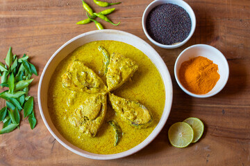 selective focus of Illish or Hilsa fish cooking with mustard seed.famous in India and Bangladesh. 