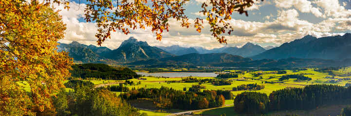 panoramic view to rural landscape with mountain range and lake at autumn