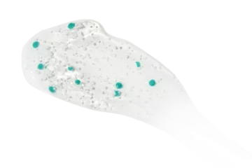 Selbstklebende Fototapeten Smear, clear gel with blue granules, serum clear on blank background. PNG © MM