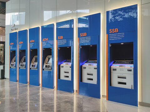 View of row of ATM and SSB at Bank BRI branch office.
