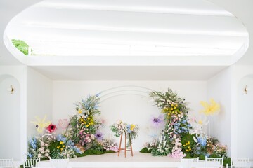 Stage decorated with flowers at the wedding
