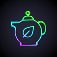 Glowing neon line Teapot with leaf icon isolated on black background. Vector