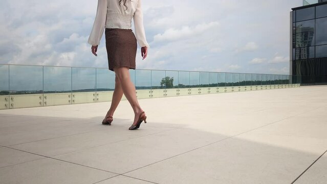 Young woman walking along an observation deck